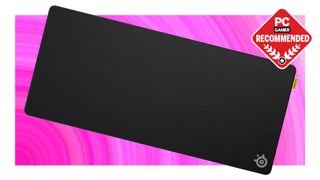 SteelSeries QcK Performance mouse pad on a pink background with PC Gamer Recommended label on top