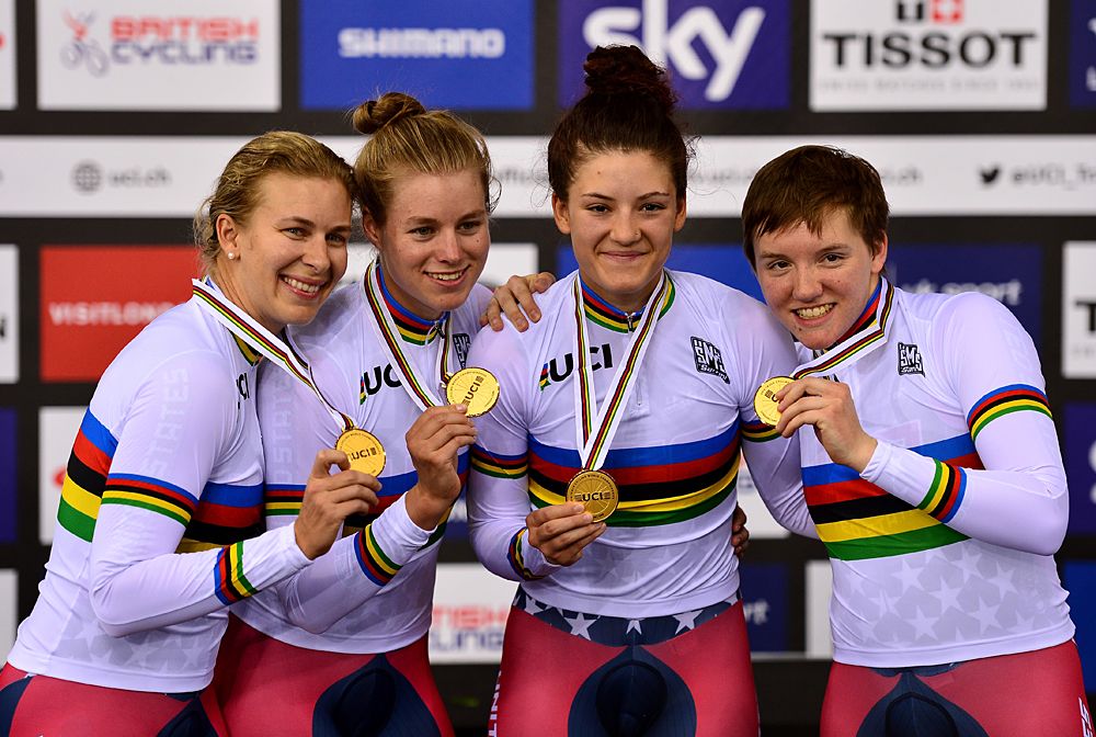 Sarah Hammer (L), Jennifer Valente (2nd L), Chloe Dygert (2nd R) and Kelly Catlin (R) of USA celebrate their gold medal after winning the Women's Team Pursuit Final