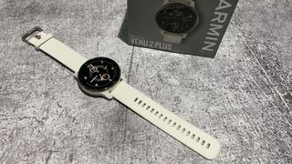 Garmin Venu 2 Plus smartwatch in cream with packaging