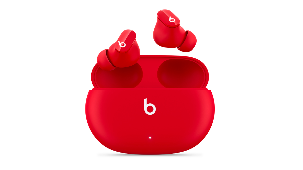 the beats studio buds in red with their charging case