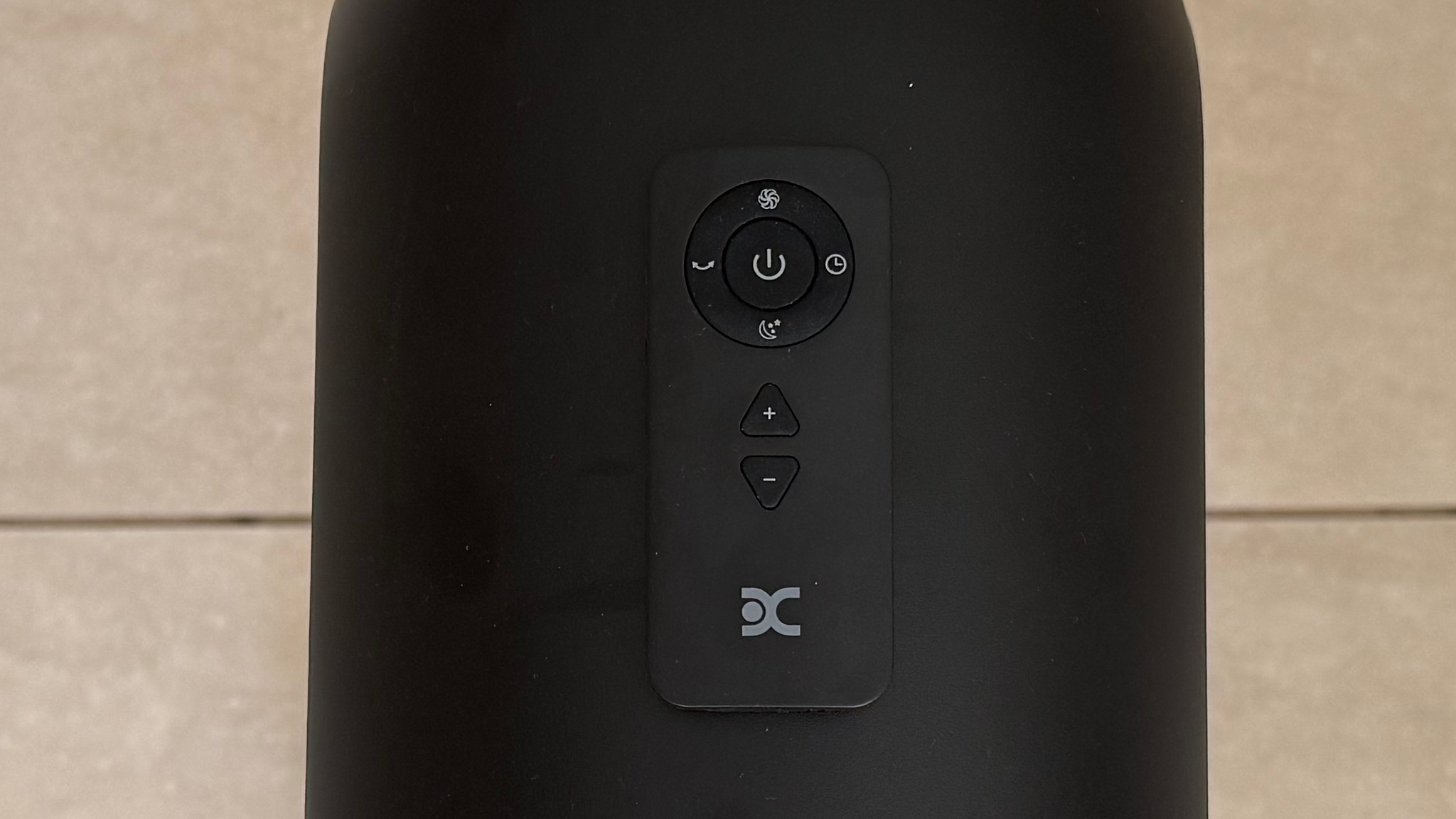 Close up of the Dimplex FlexBlade remote on its magnetic perch