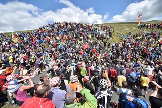 Jens Voigt makes his way through the crowds at the 2014 Tour de France (Sunada)