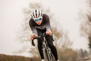 Male cyclist pacing an effort with a power meter