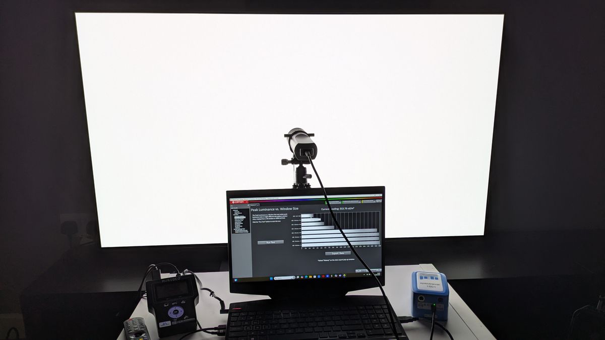 LG G5 with testing equipment attached and fullscreen white window pattern on screen