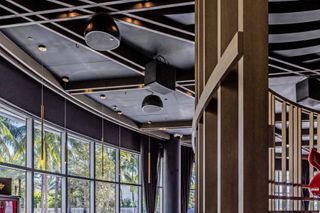 Loudspeakers and subwoofers from DAS Audio hang in a Miami high-end steakhouse.