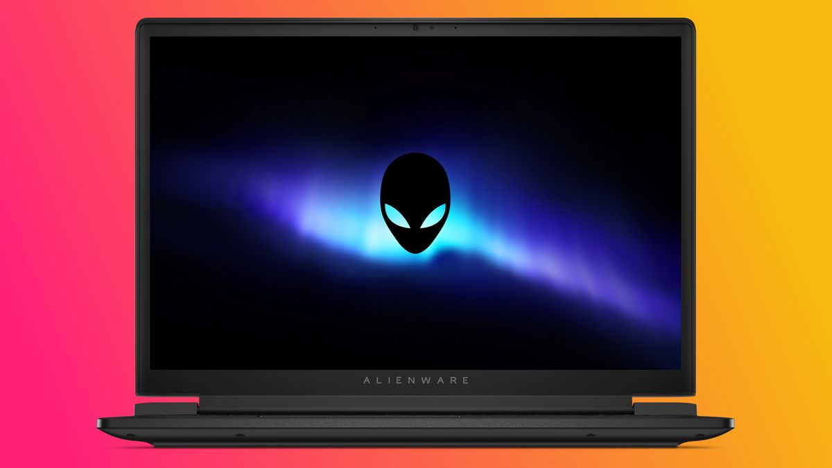 Alienware laptop displaying a glowing blue and purple aurora with an alien logo on the screen. Background is a vibrant pink and orange gradient.