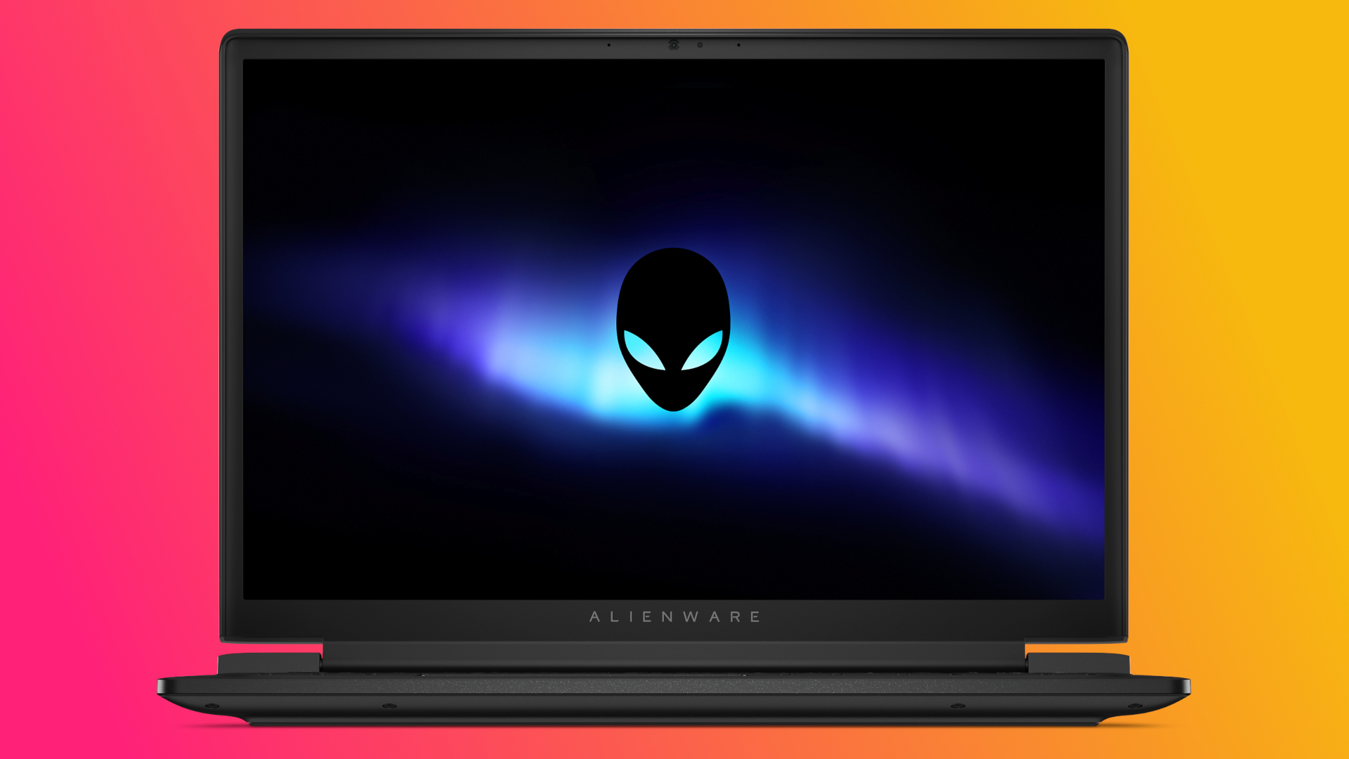 Alienware laptop displaying a glowing blue and purple aurora with an alien logo on the screen. Background is a vibrant pink and orange gradient.