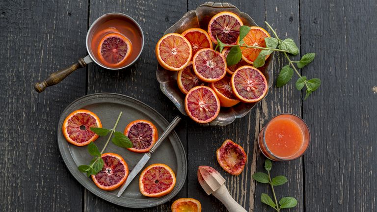 Sliced blood oranges arranged on a table