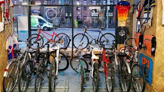 The Charity Bike shop Displaying bikes and accessories in front of a window