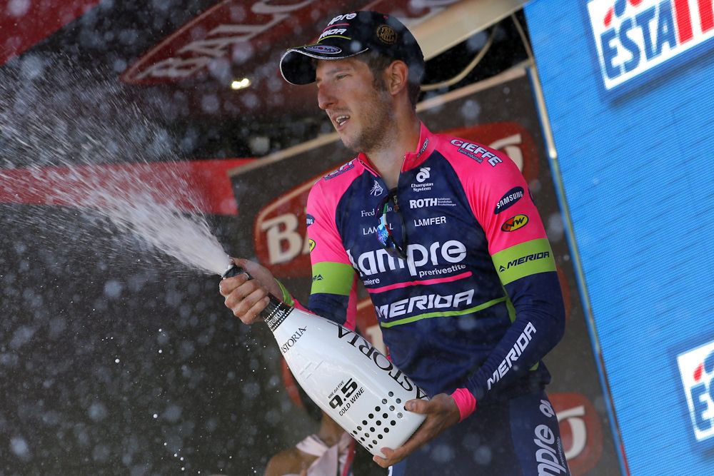 Sacha Modolo (Lampre-Merida) sprays the obligatory champagne after winning stage 17.