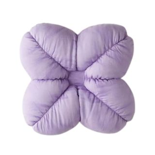 A purple flower shaped cushion