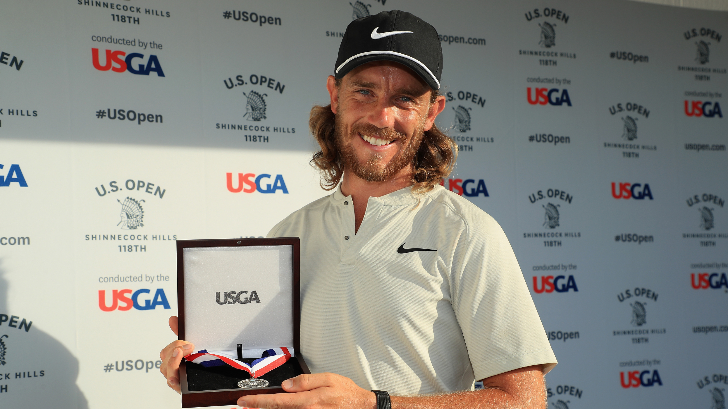 Tommy Fleetwood with a US Open silver medal