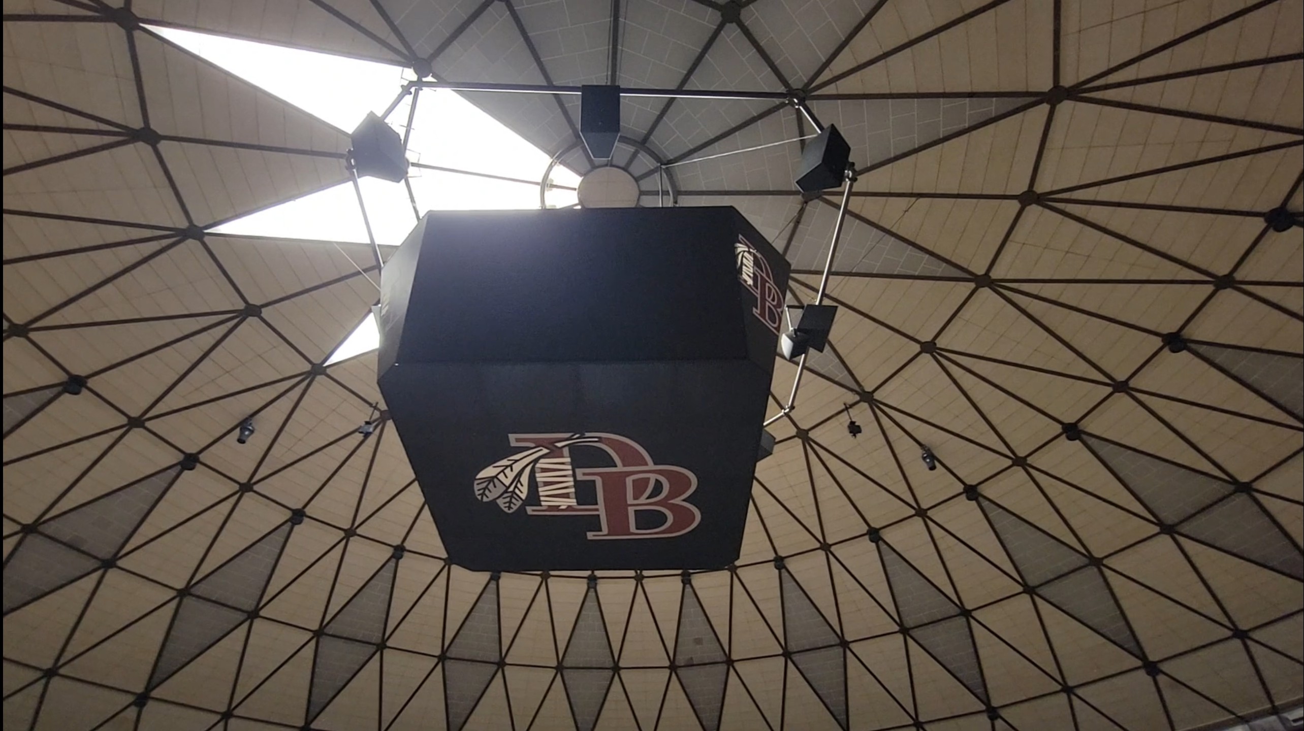 The domed ceiling of Dobyns-Bennett Gymnasium donned with JBL loudspeakers.