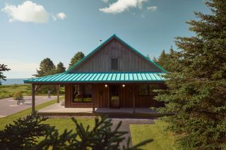 Daniel Arsham x Kohler cabin by lake with teal roof