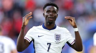 Bukayo Saka celebrates his equaliser for England against Switzerland at Euro 2024.