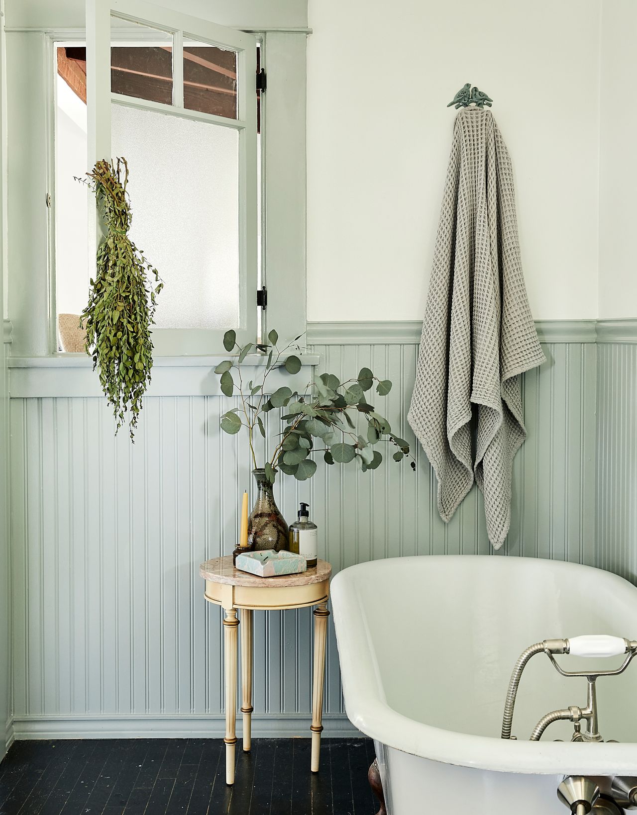 bathroom with roll top bath and aqua tongue and groove panelling