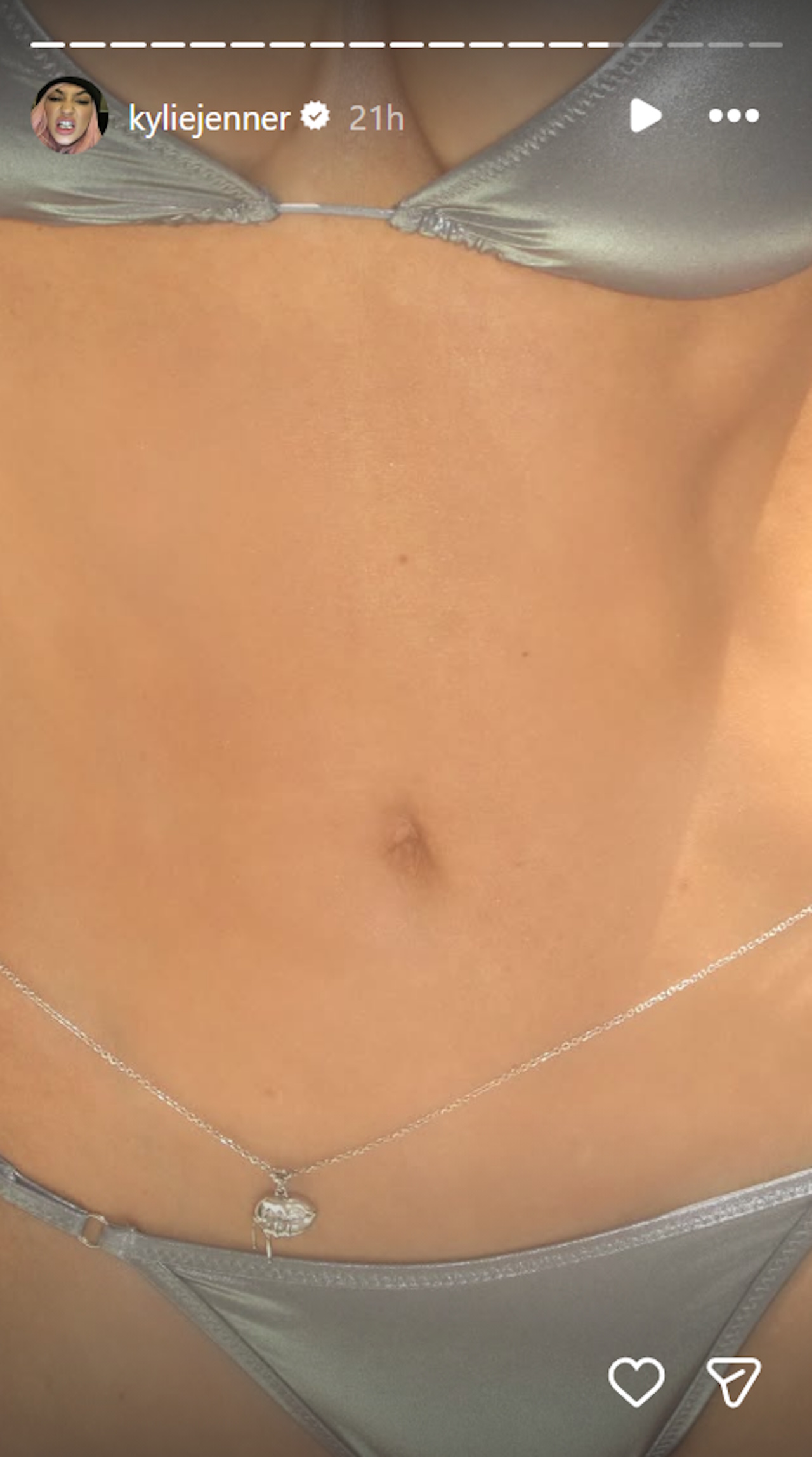 A close-up shot of Kylie Jenner's silver belly chain.