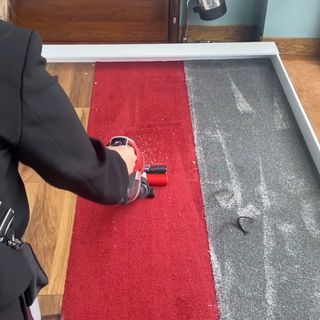 Image of Hoover being used on carpet