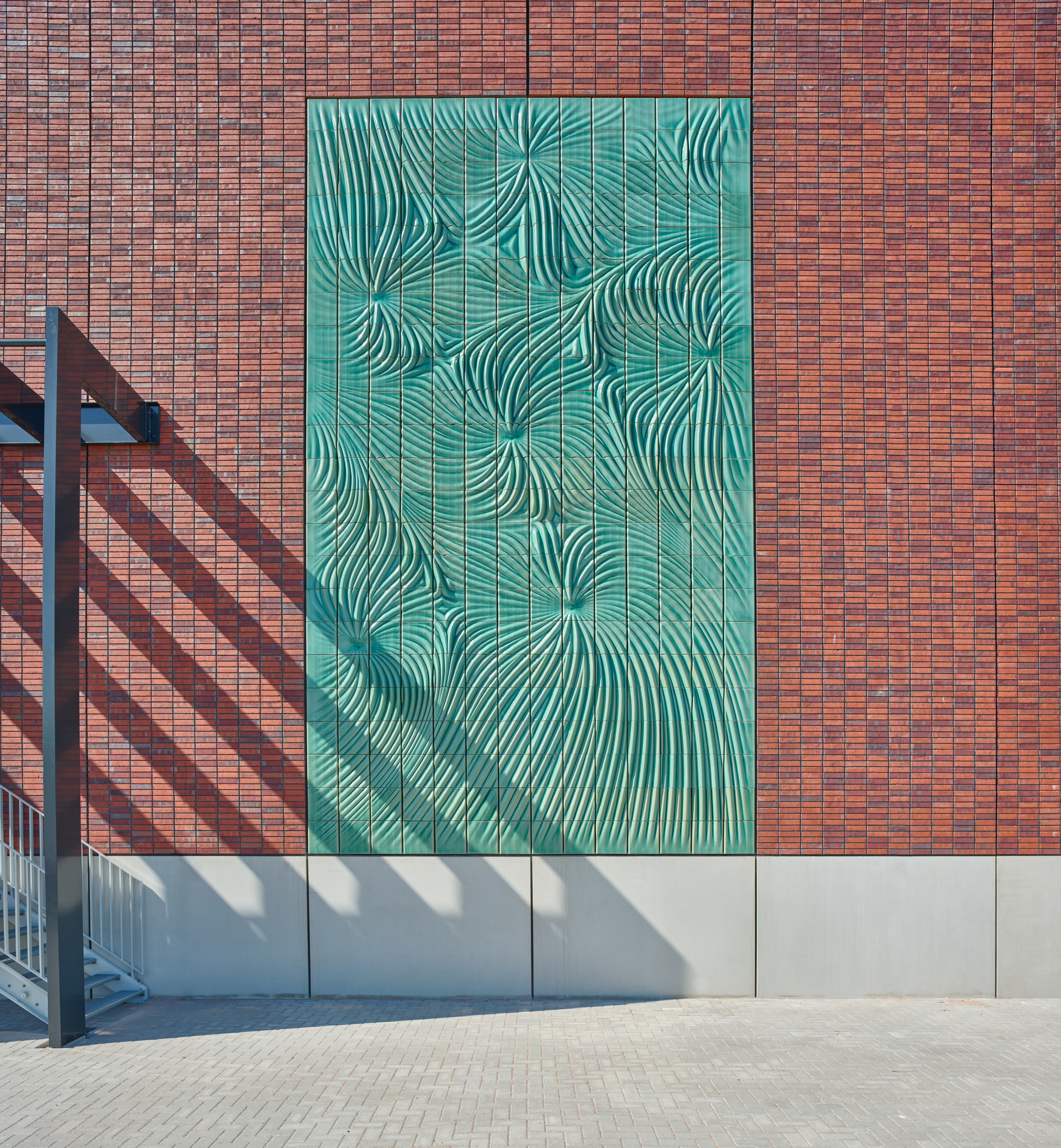 Powerwall is mounted on the brick fa&amp;ccedil;ade of Switchstation Beverwijk