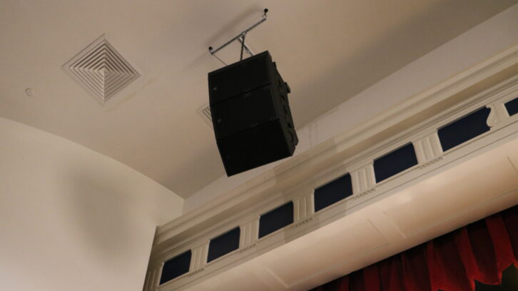 A Martin Audio loudspeaker installed in the ceiling of a church.
