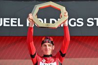 UAE Team Emirates' Slovenian rider Tadej Pogacar celebrates on the podium with the trophy after winning the 2025 UAE Tour in Jebel Hafeet on February 23, 2025. (Photo by Giuseppe CACACE / AFP)