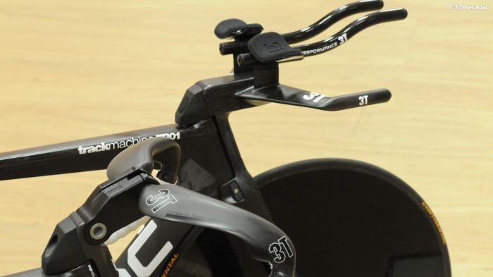 Rohan Dennis' hour record attempt bike alongside a stock TR01 showing the difference between the standard adjustable stem and Rohan's custom built one-piece integrated model
