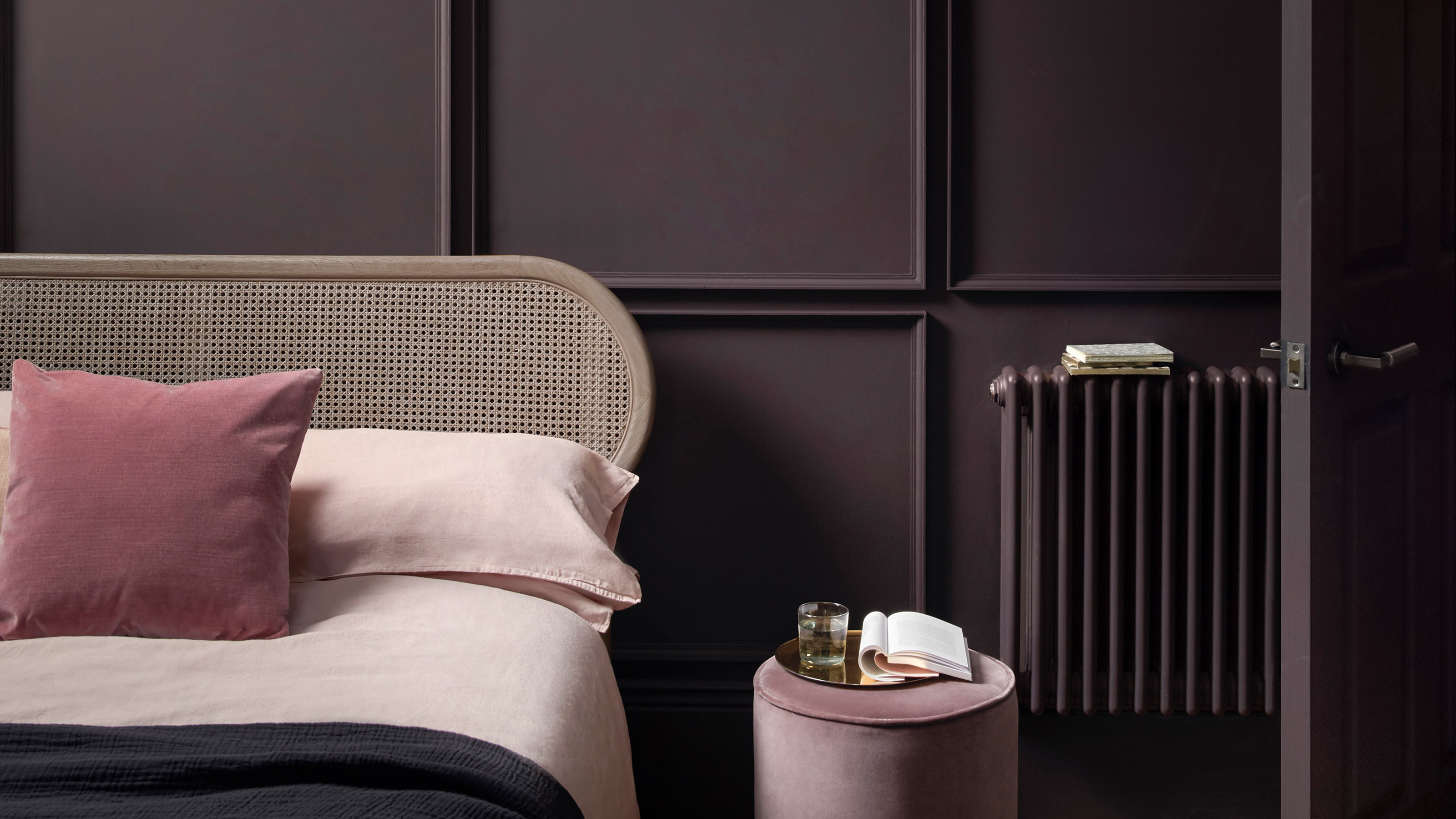 A bedroom painted in dark aubergine 'Pontefract' paint by Paint &amp; Paper Library