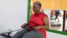 How to use a rowing machine: Image shows woman rowing