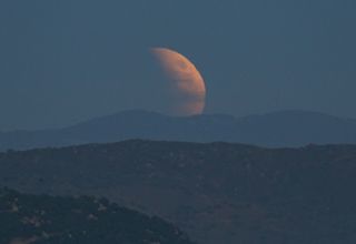 Skywatcher John Melson of Escondido, California captured this jaw-dropping view of the eclipsed moon rising over nearby hills during the total lunar eclipse of Sept. 27, 2015. He compared the moon to the Death Star from Star Wars.