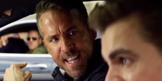 6 Underground Ryan Reynolds pointing angrily out the car window during a chase