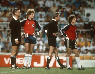 Toni Schumacher and Jean-Luc Ettori during a break in proceedings in West Germany's game against France at the 1982 World Cup.