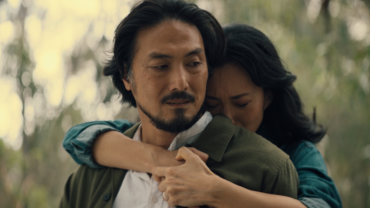 Keiko hugging adult Hiroshi from behind in Monarch: Legacy of Monsters Season 2