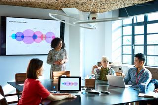 Woman leads a presentation in a meeting room