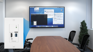 The new Extron receiver superimposed in front of a conference room.