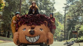 Megan, Paige and Veronica riding a giant hedgehog-car in The Slumber Party.