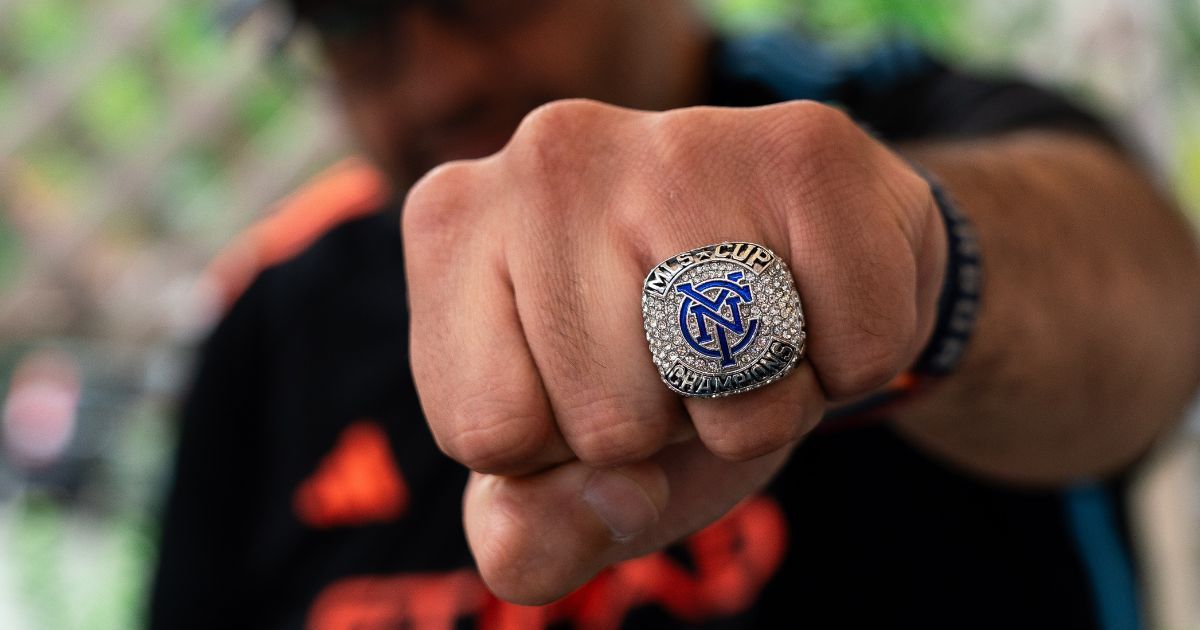 New York City FC fan Felix Palao pulls a fist and shows off his New York City FC 'superbowl' style ring, gifted to him and fellow supporters after the club won the MLS Cup in 2021