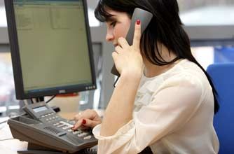 Teenage girl talking on the phone at work