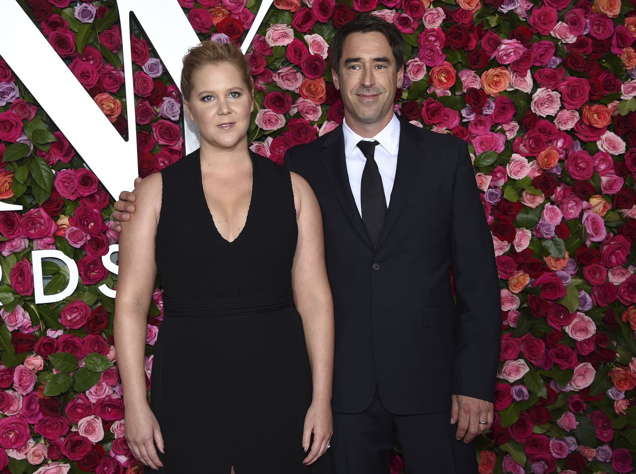 Amy Schumer and Chris Fischer.