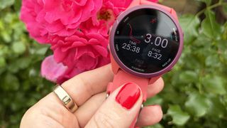 a photo of the Oura Ring 5 and the Garmin Forerunner 170
