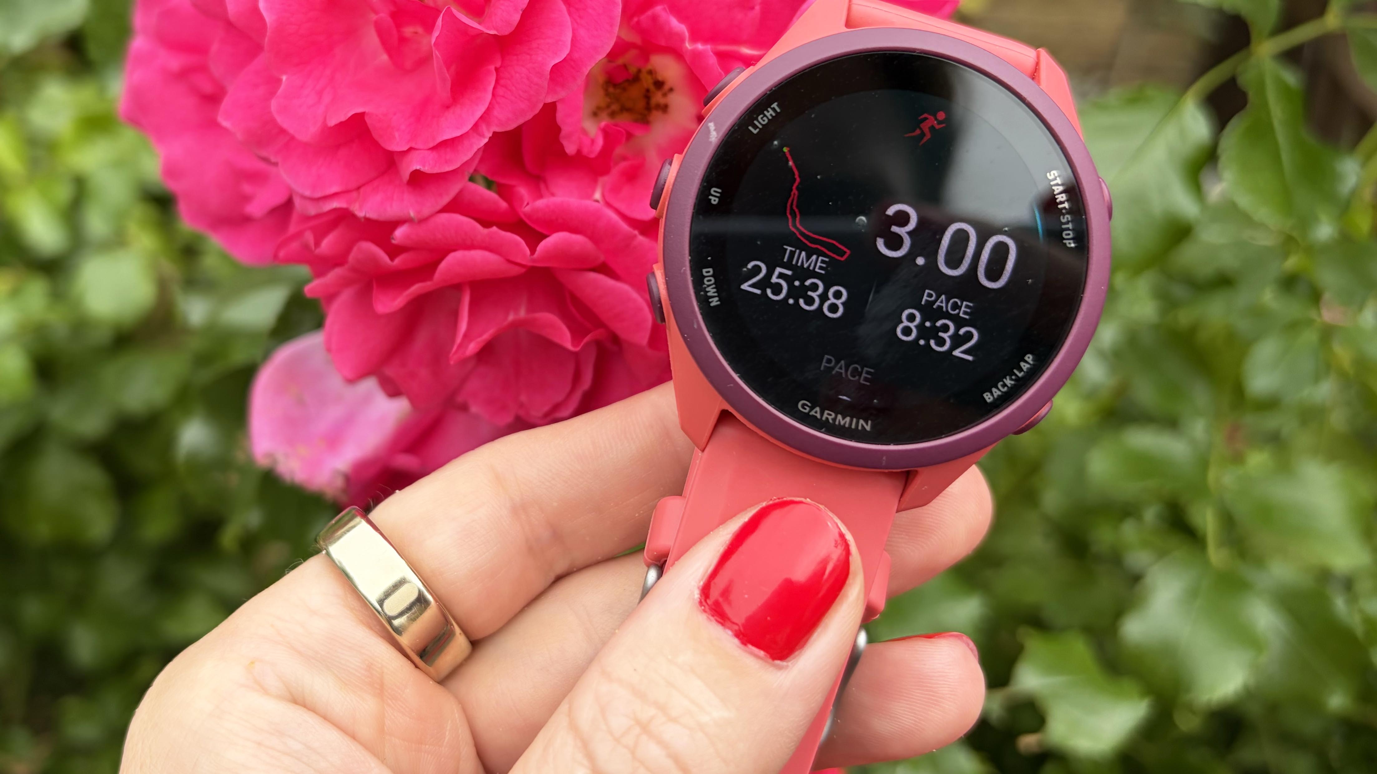 a photo of the Oura Ring 5 and the Garmin Forerunner 170