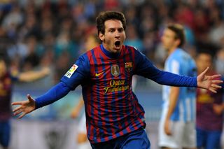 Lionel Messi celebrates after scoring for Barcelona against Malaga in January 2012.