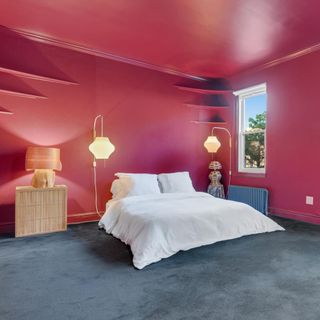 Bedroom with red walls and bed