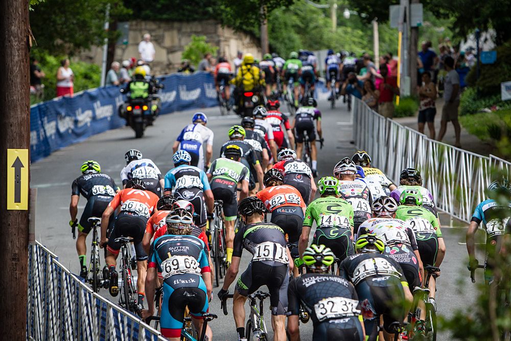 The men's peloton tackles the climb.