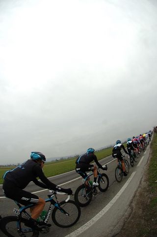 Team Sky at the back of the long, single file peloton