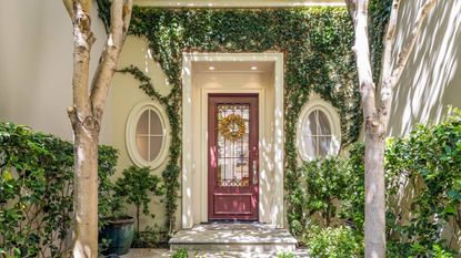 Red front door with wreath