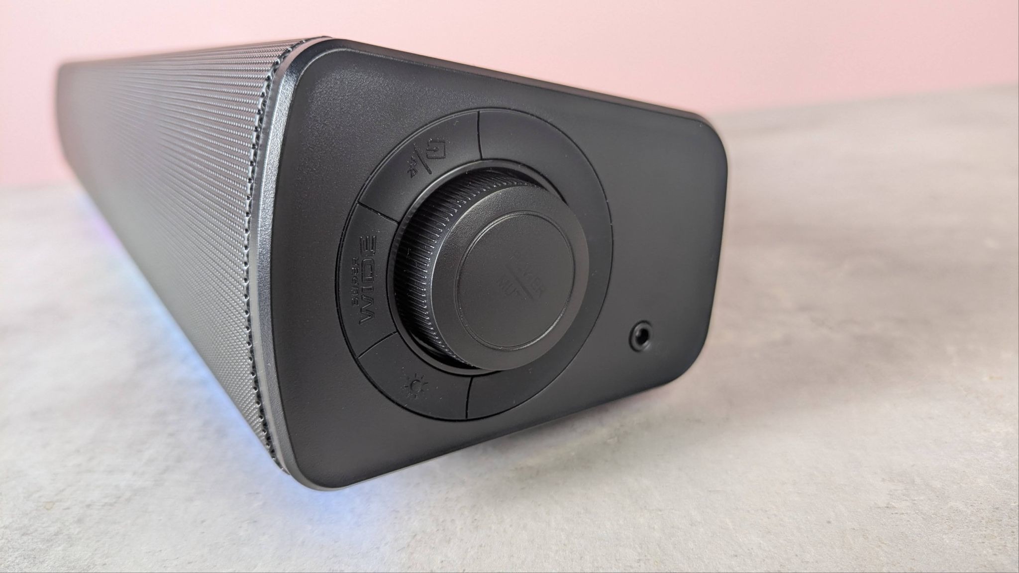 Creative Sound Blaster GS5 on a desk with pink wall in background