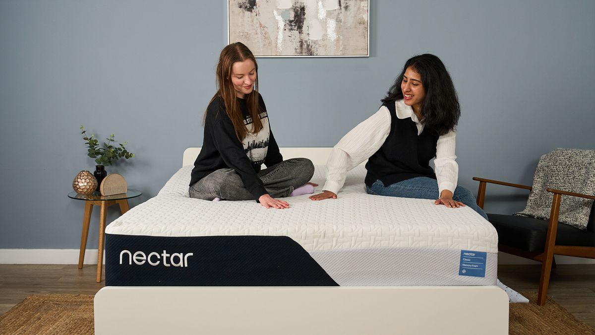 Mattress testers Frances Daniels and Becky George sit on the Nectar Classic Memory Foam Mattress in the Tom's Guide Sleep Lab