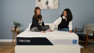 Mattress testers Frances Daniels and Becky George sit on the Nectar Classic Memory Foam Mattress in the Tom's Guide Sleep Lab