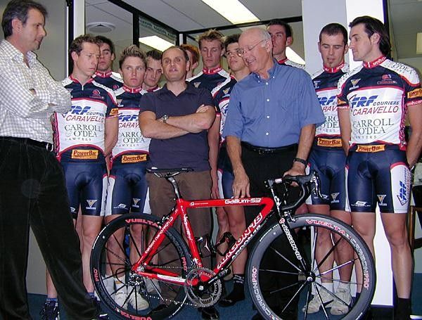 Dominic Caravello (holding bike)