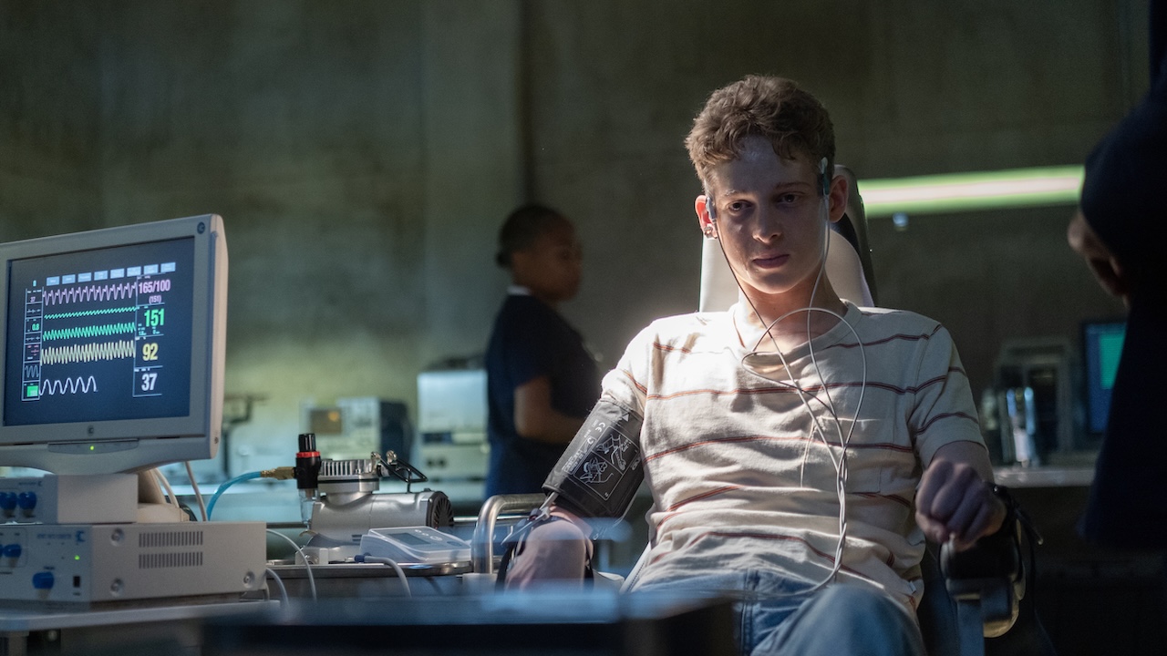 Luke strapped to electrodes and computer in The Institute